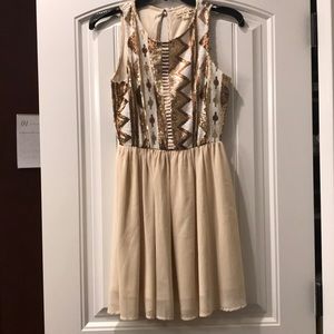 Cream dress with tan and brown sequins on top